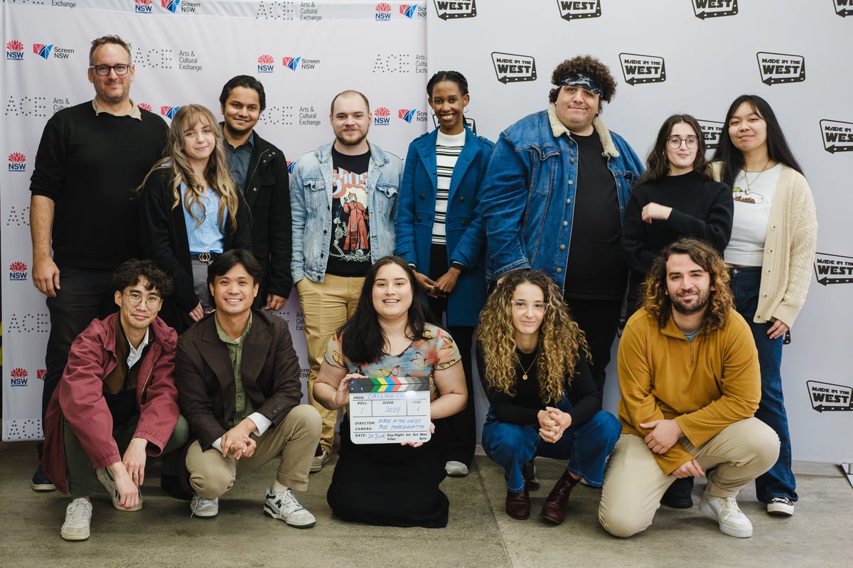 Group of young filmmakers happy to complete training